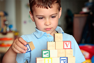 You boy playing with blocks